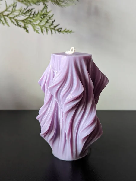 Handmade Ecological Vegan Soy Wax Candle Shape Purple Wave Stock Image