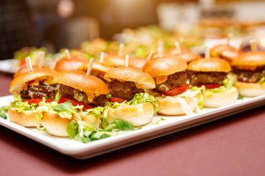 Small burgers at the buffet or event catering