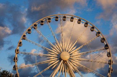 Ferris wheel with beautiful sunset clouds in the background