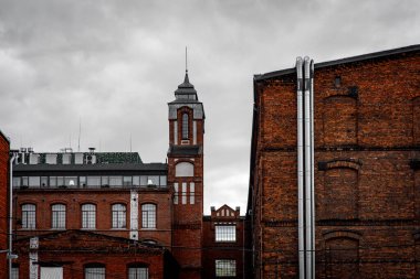Red brick facade of the factory