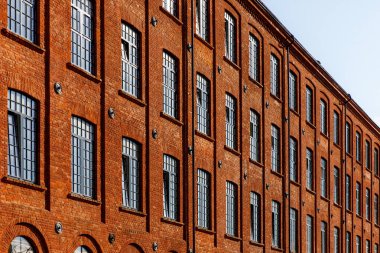 Red brick facade of the factory