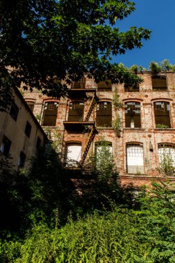 Red brick facade of an abandoned factory