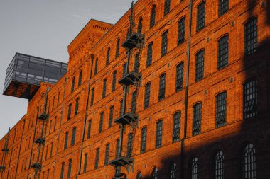 Red brick facade of the factory