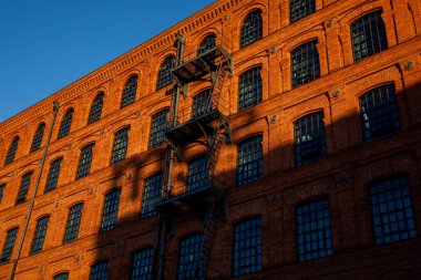 Red brick facade of the factory