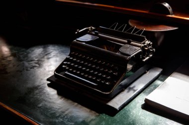 Old vintage typewriter on the desktop