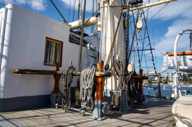 Wooden deck of an old sail ship, sailboat rigging