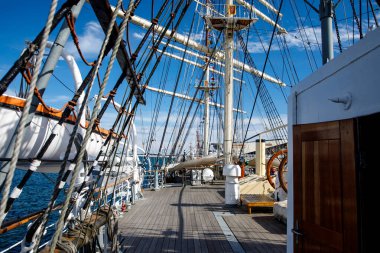 Wooden deck of an old sail ship, sailboat rigging