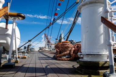 Wooden deck of an old sail ship, sailboat rigging