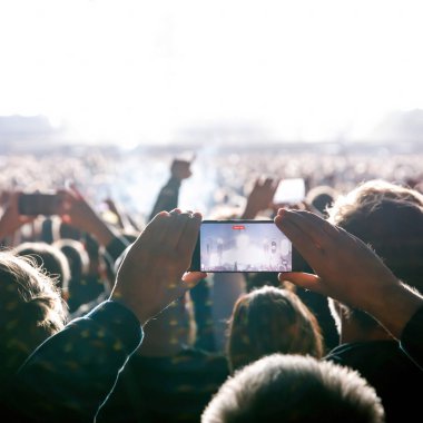 Streaming from the dance floor via mobile phone. Concert show