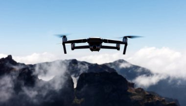 A drone flying over landscapes and making beautiful pictures and videos