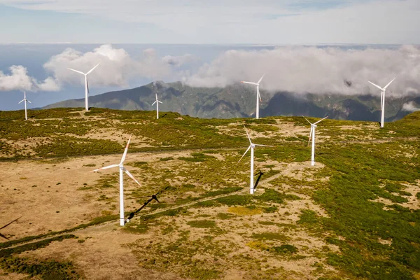 stock image Wind turbines for green energy in a windy place high in the mountains above the clouds