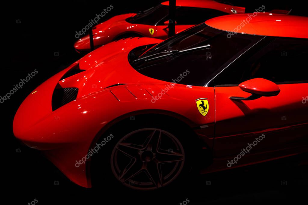 Maranello, Italy - April 01, 2023: Side view of Ferrari red sport car
