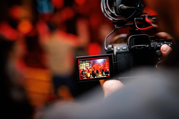 stock image Filming a party via camera with rotating screen