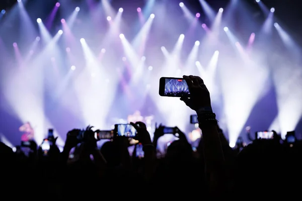 stock image People at concert shooting video or photo using mobile phones