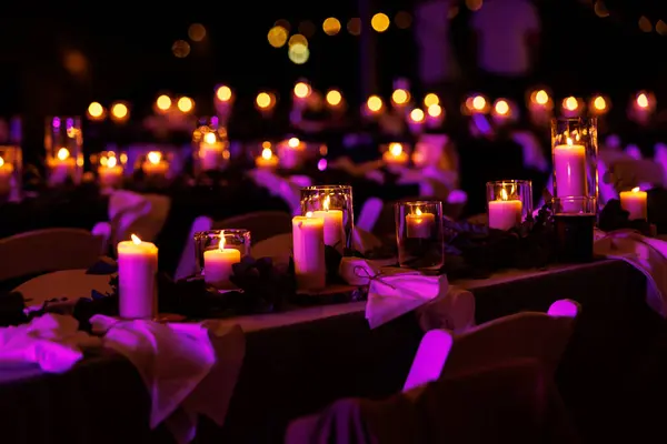Candles on the table glowing in the night
