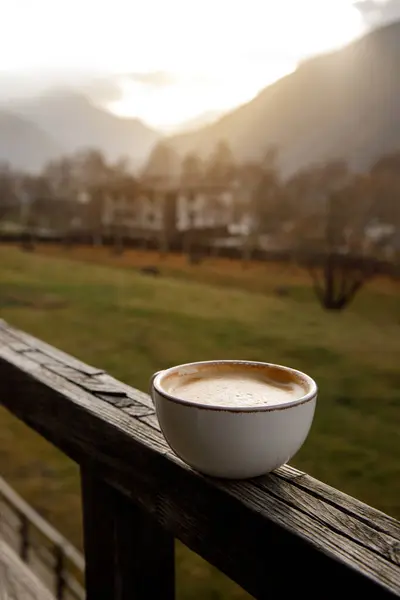 Coffee against the backdrop of a mountain valley