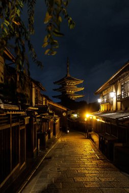 Kyoto iconic view at night. Sannenzaka Street with Yasaka pagoda. Traditional Japanese street clipart