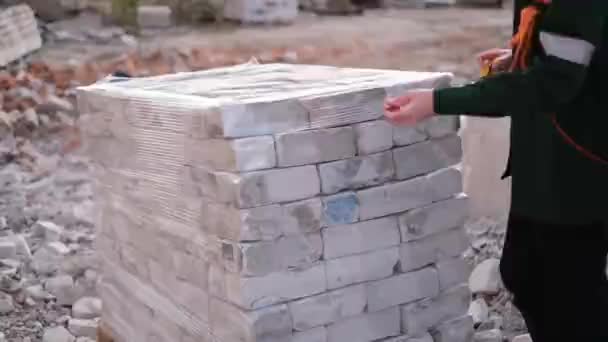 Builder Protective Uniform Helmet Measures Pallets Bricks — Stock Video
