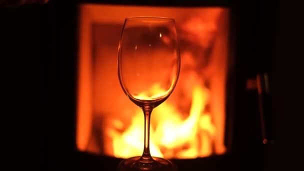 Man Pouring Wine Glass Front Fireplace — Video