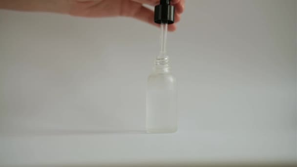 Woman Hand Takes Out Pipette Cosmetic Face Serum Glass Jar — Vídeo de Stock