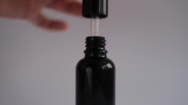 Woman Hand Takes Out Pipette Cosmetic Face Serum Glass Jar — Stockvideo