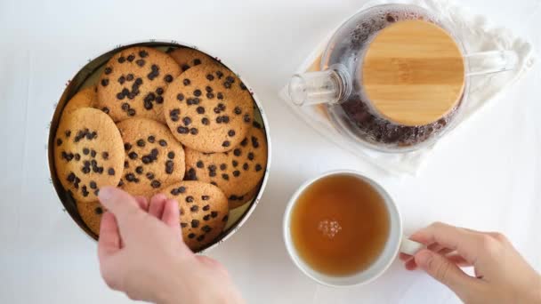 Man Hand Takes American Cookies Box Cup Tea Table Top — Stock Video