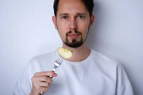 Portrait Young Man Eating Piece Apple Royalty Free Stock Photos