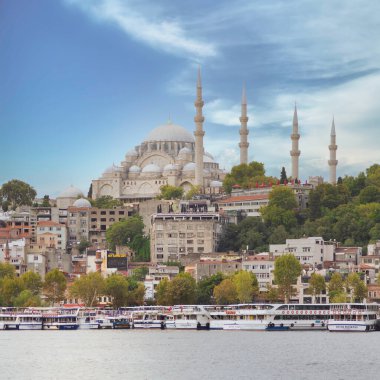 Istanbul city view from Karakoy neighborhood overlooking the Golden Horn with docked ferry boats, and Suleymaniye Mosque, Istanbul, Turkey