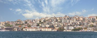 Istanbul, Turkey - August 29, 2022: View from Bosphorus Strait of the European side of Istanbul with Mimar Sinan Fine Art University, located beside Galata Port, Karakoy district