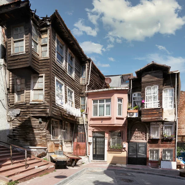 stock image Beautiful old traditional wooden and stone houses, and stone staircase, in old Balat district, on a summer day, Istanbul, Turkey