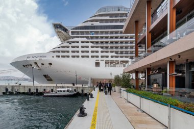 Istanbul, Turkey - May 5, 2023: MSC SPLENDIDA, Large cruise ship docked at terminal of Galataport, a mixed use development located along shore of Bosphorus strait, in Karakoy neighbourhood clipart