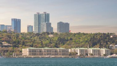 View from the Bosphorus strait of Ciragan Palace Kempinski, a luxury hotel located in Istanbul, Turkey. The palace was built in the 19th century and is now a popular tourist destination clipart