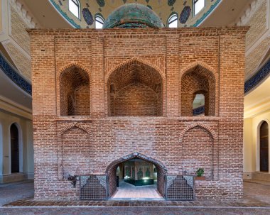 Ganja, Azerbaijan - May 13 2024: The Imamzadeh Mausoleum features stunning brick architecture and detailed craftsmanship, showcasing historical significance clipart