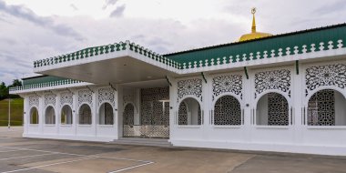 The Royal Mausoleum, Malay: Kubah Makam Diraja, features intricate architecture against a vibrant sunset, Located in Batu Satu, Bandar Seri Begawan, Brunei Darussalam