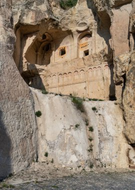 Dark Church, Turkish: Karanlik Kilise, rock-cut monastery facade at Goreme UNESCO World Heritage Site, Cappadocia, Turkey. Ancient architecture carved into the cliff face
