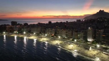 Sunset Sky At Copacabana Beach In Rio De Janeiro Brazil. Sunset Dusk Skyline. Tourism Scene. Copacabana Beach At Rio De Janeiro Brazil. Sunset Evening Skyline. Sunset Skyline.