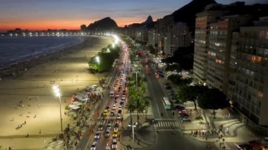 Sunset Sky At Copacabana Beach In Rio De Janeiro Brazil. Sunset Dusk Skyline. Tourism Scene. Copacabana Beach At Rio De Janeiro Brazil. Sunset Evening Skyline. Sunset Skyline.