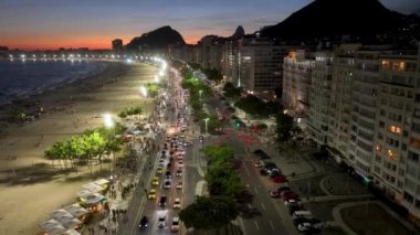 Dusk Skyline At Copacabana Beach In Rio De Janeiro Brazil. Sunset Dusk Skyline. Tourism Scene. Copacabana Beach At Rio De Janeiro Brazil. Sunset Evening Skyline. Sunset Skyline.