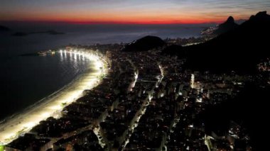 Sunset Sky At Copacabana Beach In Rio De Janeiro Brazil. Sunset Dusk Skyline. Tourism Scene. Copacabana Beach At Rio De Janeiro Brazil. Sunset Evening Skyline. Sunset Skyline.