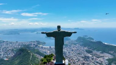 Christ The Redeemer At Corcovado Mountains In Rio De Janeiro Brazil. Helicopter Hovering Over Christ The Redeemer.Christ The Redeemer At Rio De Janeiro Brazil. Christ Redeemer Mountains Skyline.