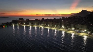 Sunset Beach At Copacabana Beach In Rio De Janeiro Brazil. Sunset Dusk Skyline. Tourism Scene. Copacabana Beach At Rio De Janeiro Brazil. Sunset Evening Skyline. Sunset Skyline.