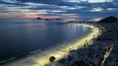 Sunset Beach At Copacabana Beach In Rio De Janeiro Brazil. Sunset Dusk Skyline. Tourism Scene. Copacabana Beach At Rio De Janeiro Brazil. Sunset Evening Skyline. Sunset Skyline.