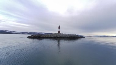 Famous lighthouse of Ushuaia City at Beagle Channel near Chile border. Patagonia Argentina. Called of End of the World Fin Del Mundo Lighthouse. Ushuaia Argentina Tierra del Fuego province.