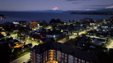 Sunset City At Puerto Varas In Los Lagos Chile. Nature Landscape. Travel Background. Los Lagos Chile. Downtown Cityscape. Sunset City At Puerto Varas In Los Lagos Chile. clipart