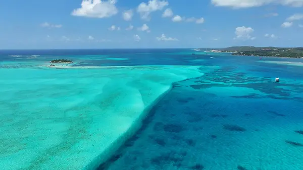 Blue Bay Water At San Andres In Caribbean Island Colombia. Colombian Caribbean Beach. Blue Sea Background. San Andres At Caribbean Island Colombia. Tourism Landscape. Nature Seascape.