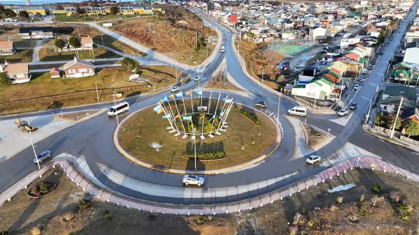 stock image Roundabout At Ushuaia In Tierra Del Fuego Argentina. Cars On Roundabout Landscape. Travel Background. Downtown Cityscape. Roundabout At Ushuaia In Tierra Del Fuego Argentina.