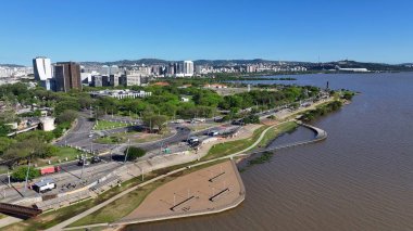 Edge Of Guaiba At Porto Alegre In Rio Grande Do Sul Brazil. Downtown District. Public Idyllic Area. Beautiful Riverside. Edge Of Guaiba At Porto Alegre In Rio Grande Do Sul Brazil. clipart