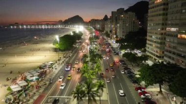 Sunset Sky At Copacabana Beach In Rio De Janeiro Brazil. Sunset Dusk Skyline. Tourism Scene. Copacabana Beach At Rio De Janeiro Brazil. Sunset Evening Skyline. Sunset Skyline.