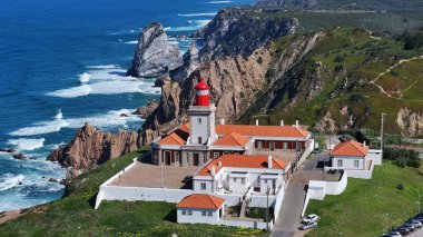 Roca Cape Lighthouse At Sintra In District Of Lisbon Portugal. Beach Skyline. Nature Landscape. Summer Travel. Roca Cape Lighthouse At Sintra In District Of Lisbon Portugal. Lighthouse Scenery.