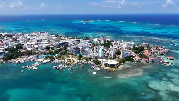 Spratt Bight Beach In San Andres Caribbean Island Colombia. Turquoise Ocean Waves Gently Crashing On Tropical Beach. Business Sky Downtown Cityscape. Outdoors Downtown Panning Wide.